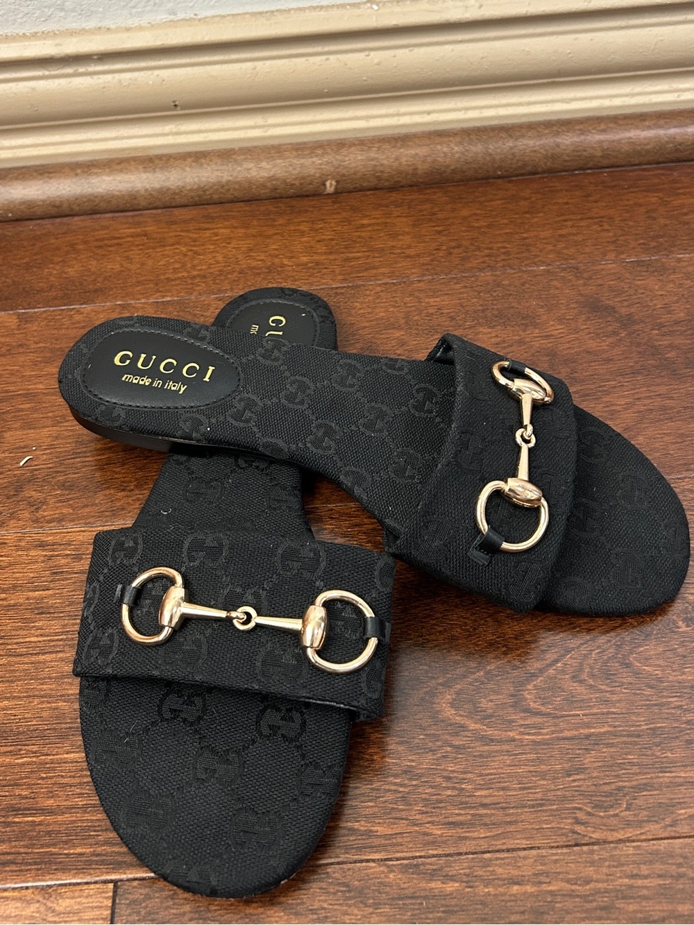 Black Gucci horsebit slides